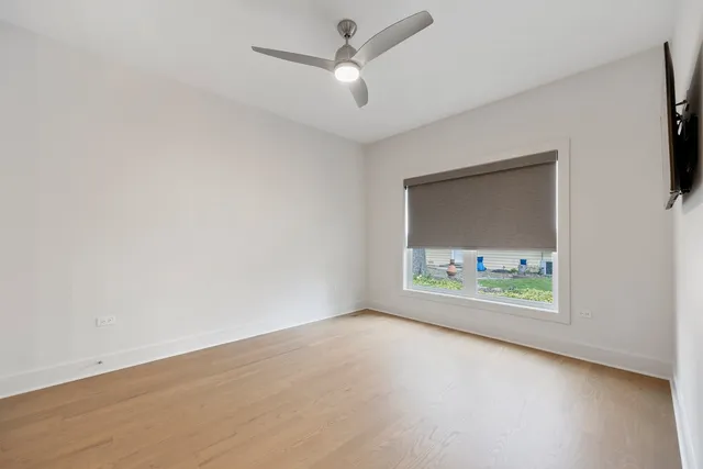 an empty room with window and windows