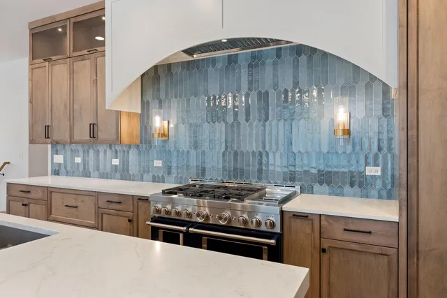 a kitchen with a stove and a refrigerator