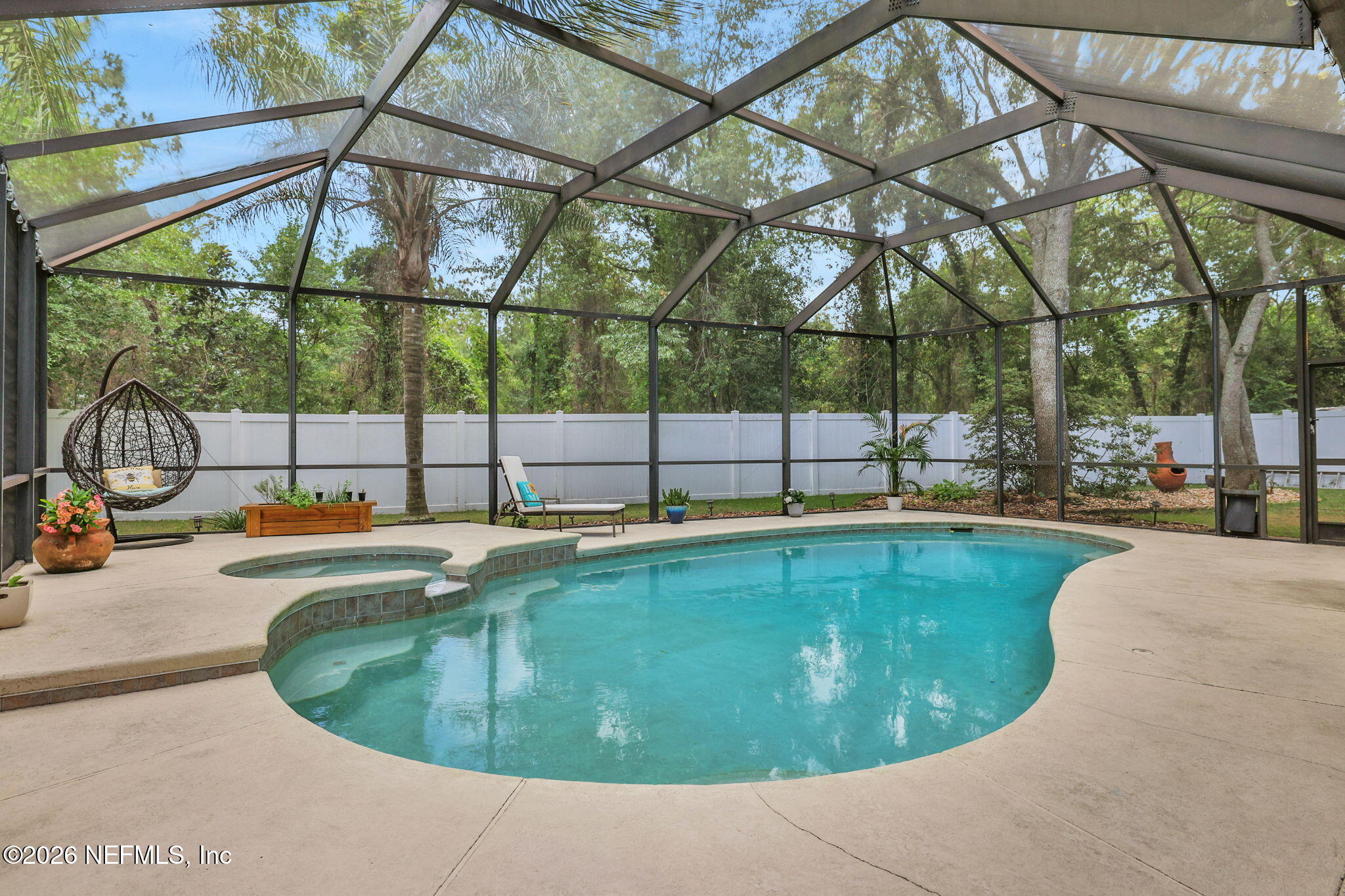 4320 Rye Court St. Johns, FL 32259 - Photo 51 of 60 a view of a swimming pool with a yard and sitting space