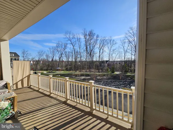 a view of a wooden fence and a yard
