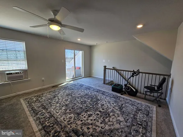 an entryway in a hall with a window