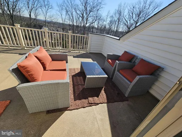 a blue and white sitting area with some trees