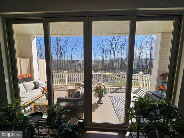 a view of a living room and a balcony