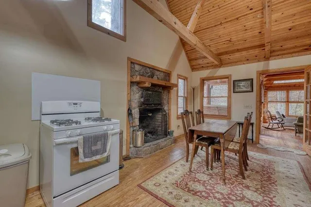 a bedroom with a bed dresser and a window