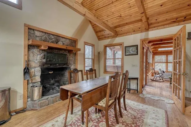 a bathroom with a granite countertop shower a mirror and a sink