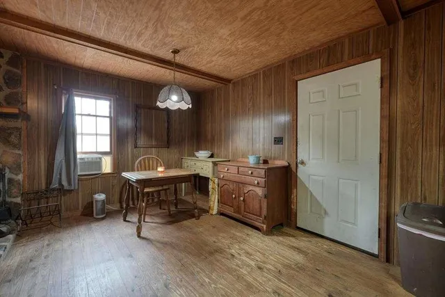 a living room with furniture a ceiling fan and a rug