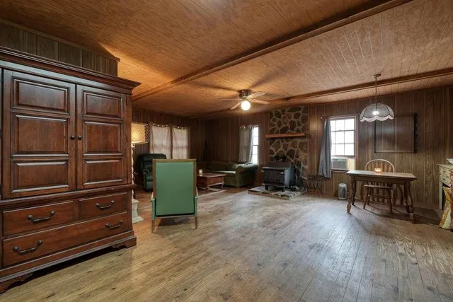 a dining room with furniture and window