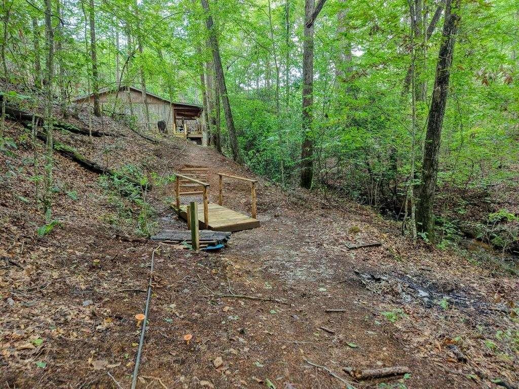 2479 Plum Orchard Road Clayton, GA 30525 - Photo 70 of 72 a view of a small house with a yard and sitting area