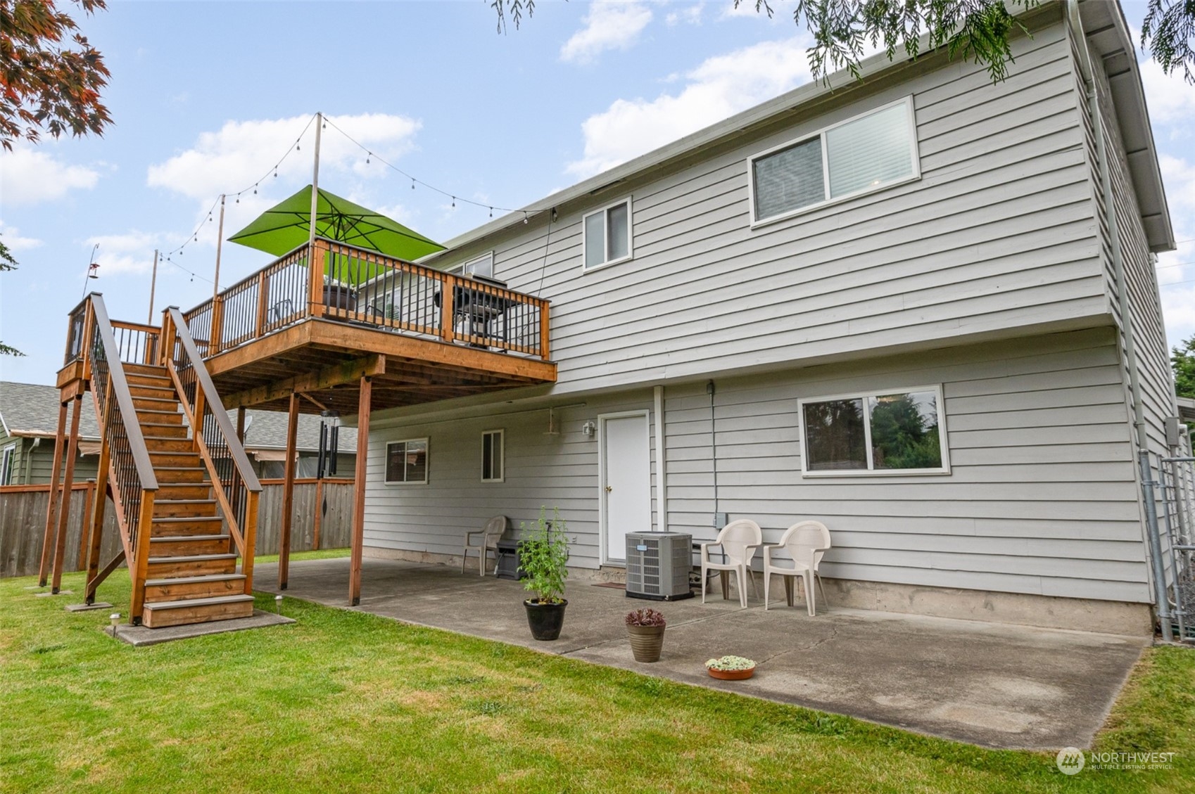 426 212th Street Southwest Bothell, WA 98021 - Photo 27 of 32 a backyard of a house with barbeque oven table and chairs
