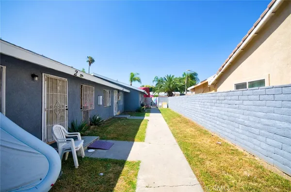 a view of backyard with patio