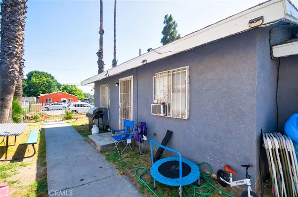 a front view of a house with outdoor seating