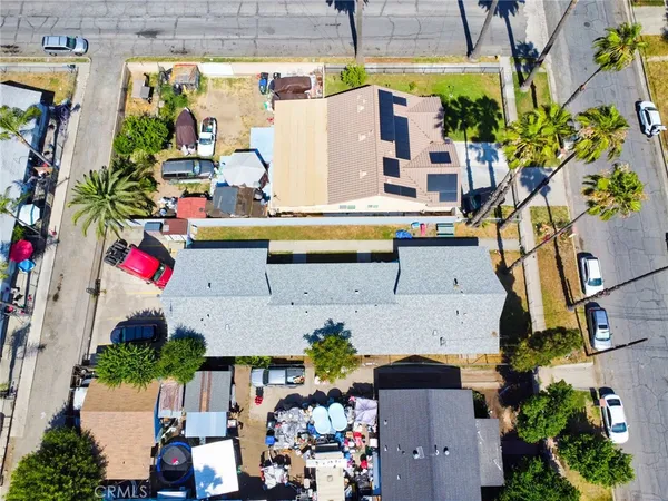 an aerial view of multiple houses with outdoor space