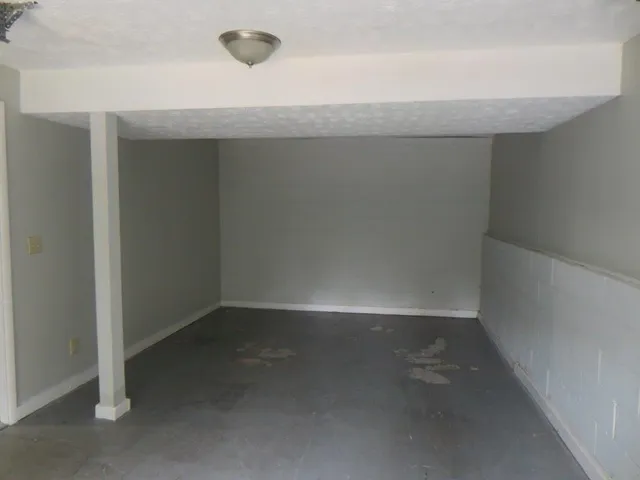 an empty room with a workbench