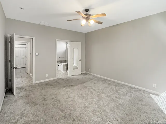 a white toilet sitting next to a bathroom sink