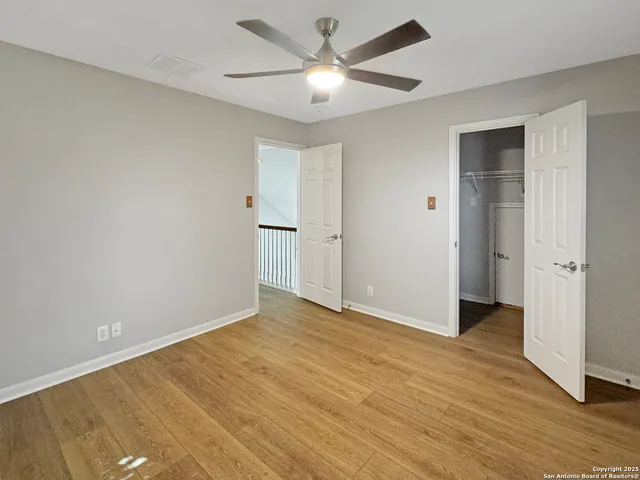 a view of a backyard with large tree
