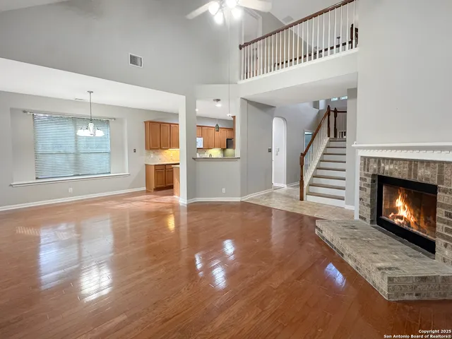 a view of a kitchen with granite countertop cabinets a sink and a dishwasher