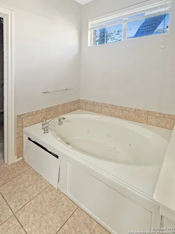 a kitchen with granite countertop stainless steel appliances and wooden cabinets