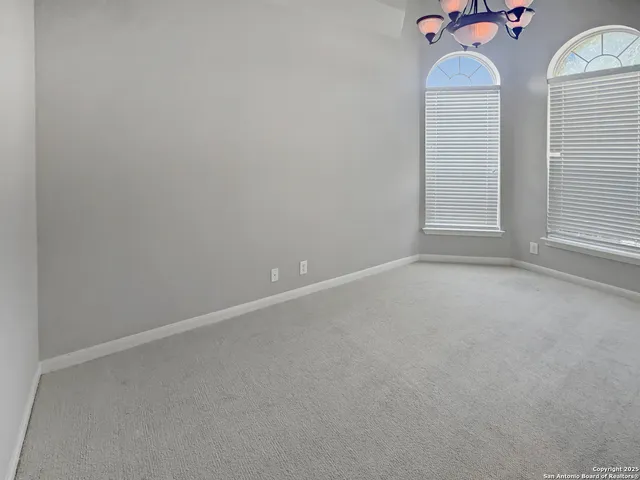 an empty room with wooden floor and closet