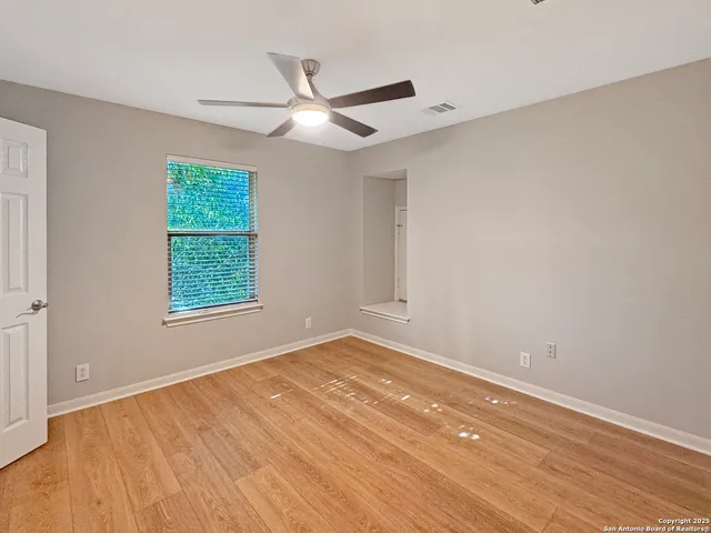 a bathroom with a granite countertop sink and vanity