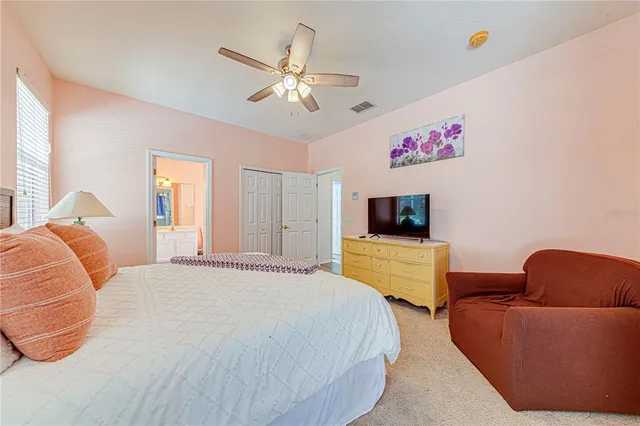 a bathroom with a double vanity sink toilet and shower