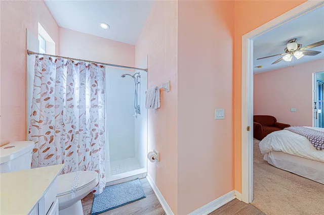 a view of a patio with a table and chairs under an umbrella