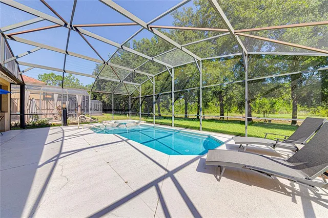 a view of a swimming pool with a patio