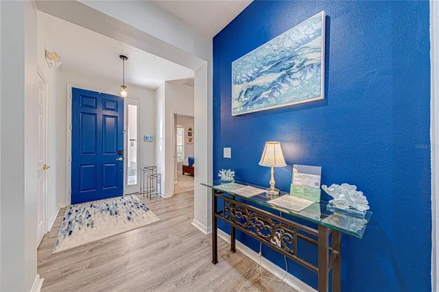 a bed room with a bed and a lamp