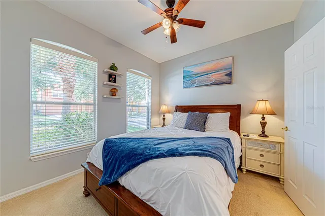 a spacious bedroom with a bed and a window