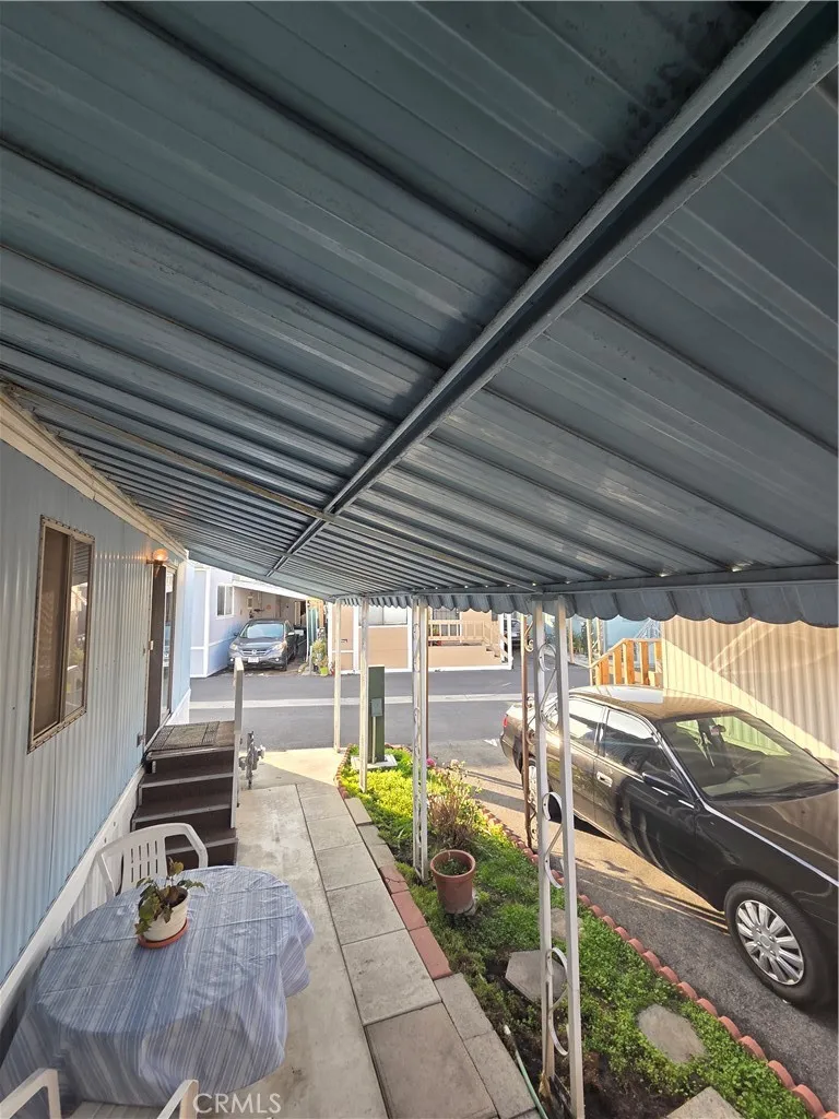 437 West Sp 3a Carson Street Long Beach, CA 90807 - Photo 22 of 29 a view of a garage with wooden floor