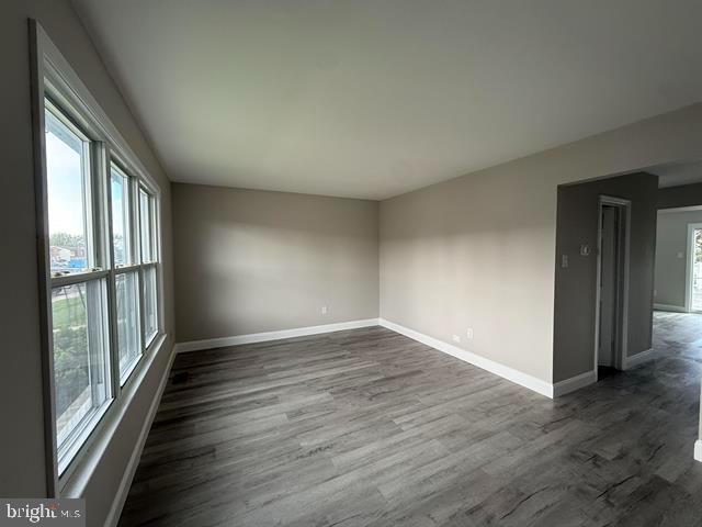 1964 East Oak Road, Unit G2 Vineland, NJ 08361 - Photo 14 of 28 an empty room with wooden floor and windows