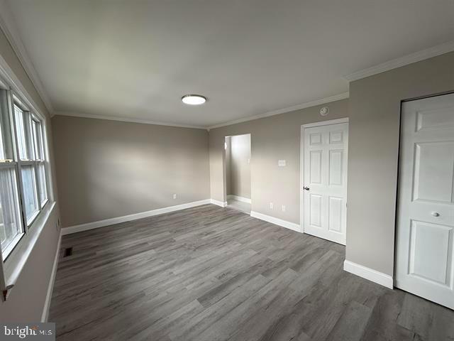 1964 East Oak Road, Unit G2 Vineland, NJ 08361 - Photo 16 of 28 an empty room with wooden floor and windows
