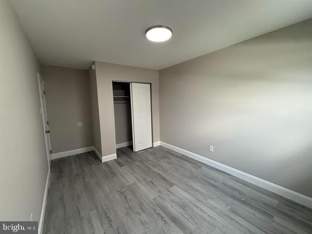 1964 East Oak Road, Unit G2 Vineland, NJ 08361 - Photo 20 of 28 a view of an empty room with wooden floor