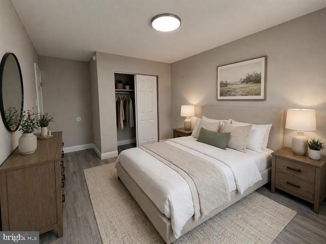 1964 East Oak Road, Unit G2 Vineland, NJ 08361 - Photo 21 of 28 a bedroom with bed and a chandelier