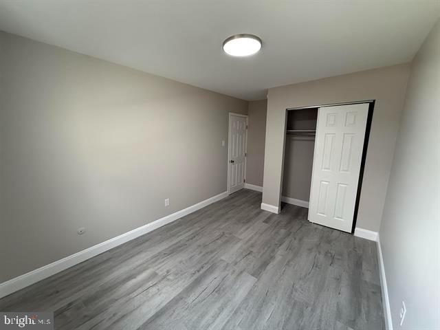 1964 East Oak Road, Unit G2 Vineland, NJ 08361 - Photo 23 of 28 an empty room with wooden floor and window