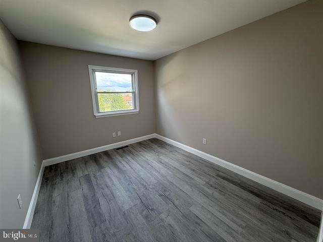 1964 East Oak Road, Unit G2 Vineland, NJ 08361 - Photo 24 of 28 an empty room with wooden floor and windows