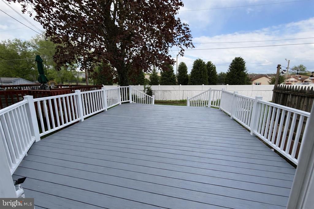 1964 East Oak Road, Unit G2 Vineland, NJ 08361 - Photo 28 of 28 a view of deck with wooden floor and fence and trees