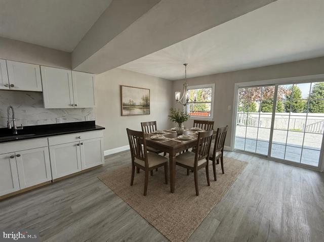 1964 East Oak Road, Unit G2 Vineland, NJ 08361 - Photo 4 of 28 a view of a dining room with furniture and wooden floor