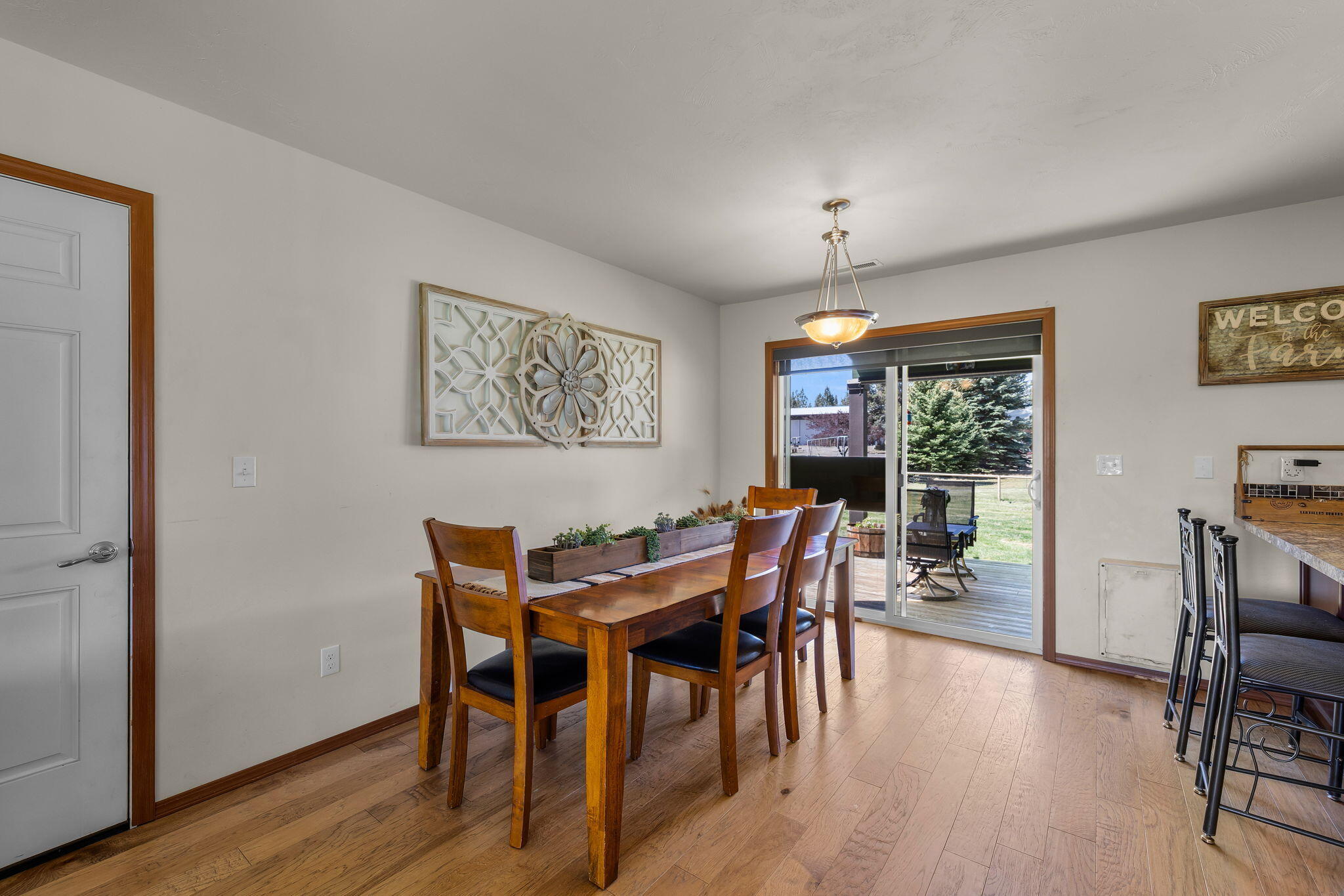 63639 Gentry Loop Bend, OR 97701 - Photo 11 of 40 a view of a dining room with furniture window and wooden floor