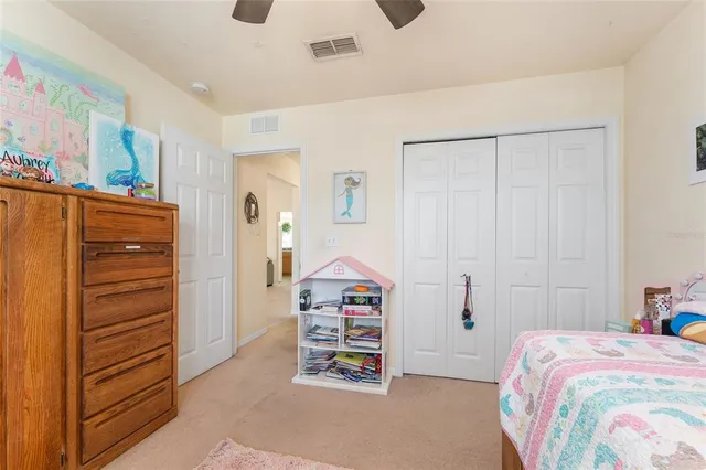 a bedroom with a bed and a closet