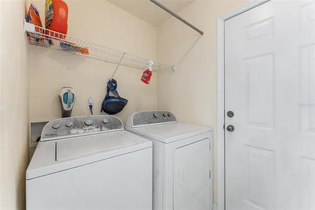 a utility room with dryer and washer