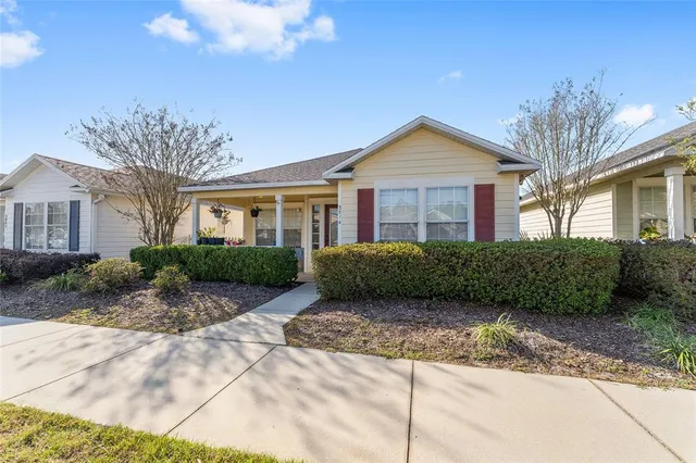 a view of a front of a house with a yard