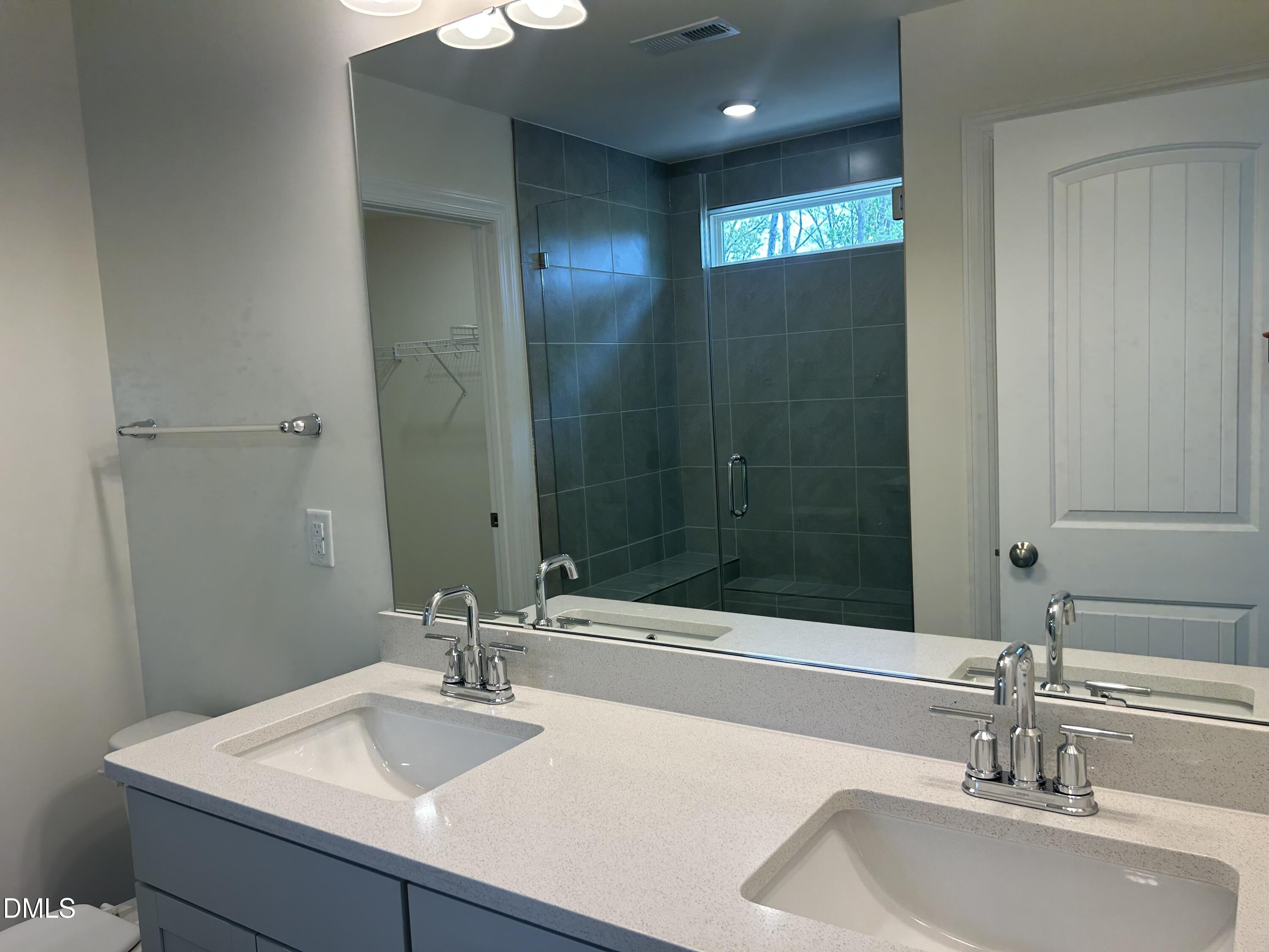 2023 Seneca Road Raleigh, NC 27604 - Photo 12 of 18 a bathroom with a sink and a mirror