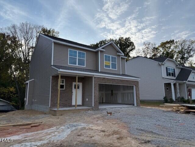 2023 Seneca Road Raleigh, NC 27604 - Photo 13 of 40 a front view of a house with a yard and garage