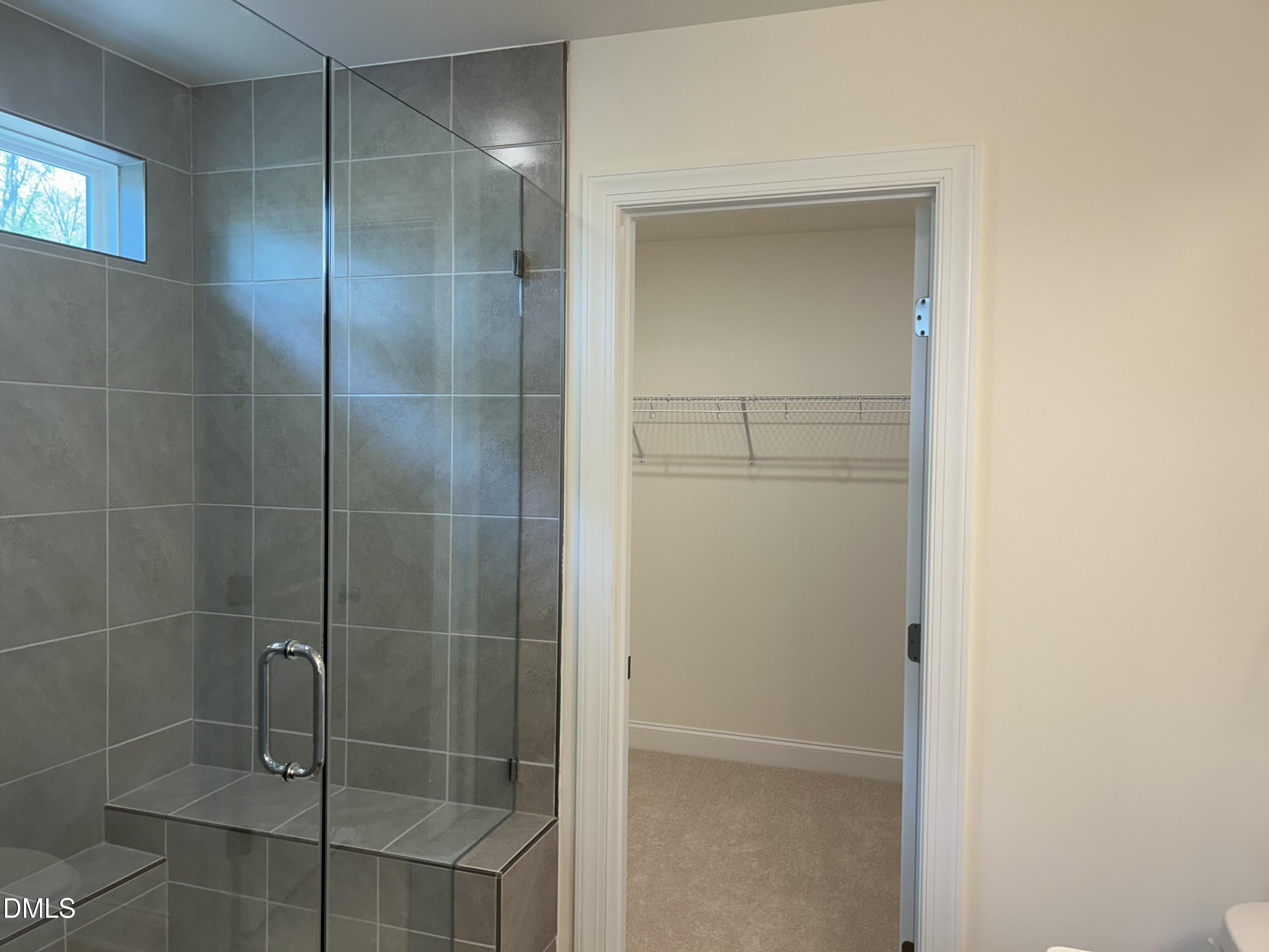 2023 Seneca Road Raleigh, NC 27604 - Photo 14 of 18 a bathroom with a glass shower door