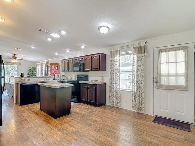 a kitchen with a refrigerator and a sink