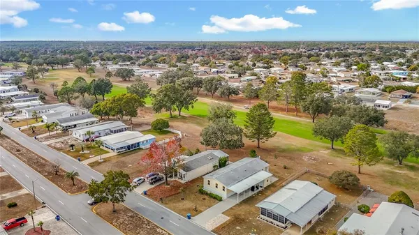 an aerial view of a house with a lake view
