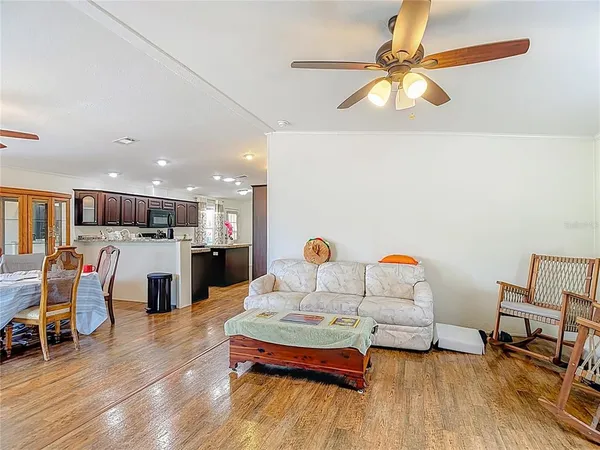 a view of an empty room and wooden floor