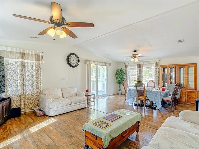 a view of an empty room and wooden floor