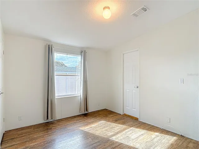 a bedroom with a bed and a table