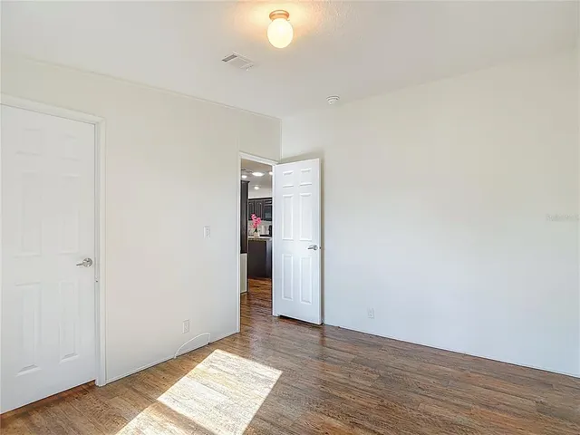 a view of a livingroom with furniture and a ceiling fan